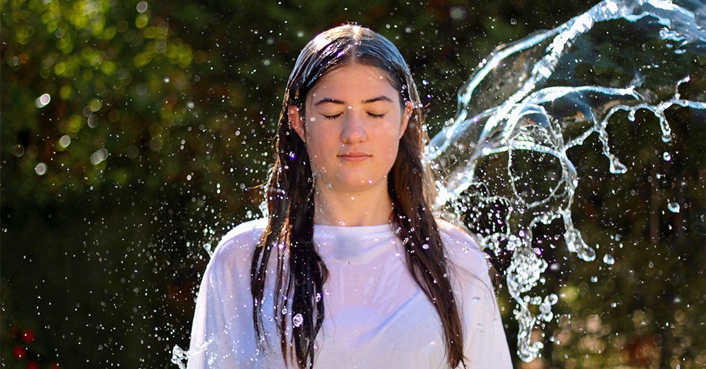 girl being splashed with water